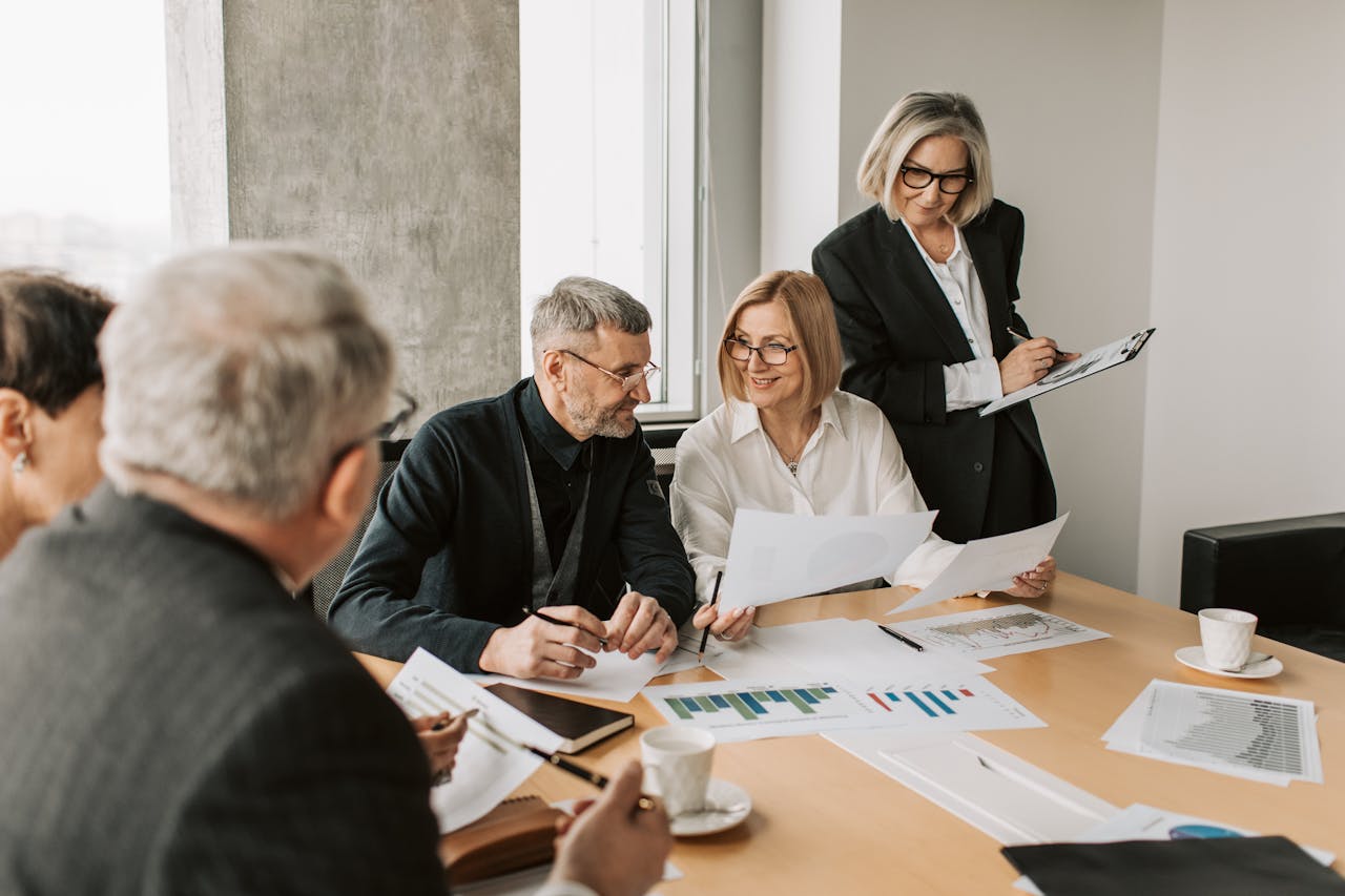 services-img A diverse group of business professionals engaged in a strategic meeting.